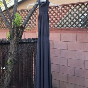 Long gray dress ties around neck, low in back